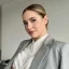 a lady in grey suit